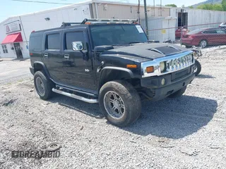 2005 Hummer H2 SUV with VIN 5GRGN23U85H107315, listed as a IAAI auction lot 42062589 with 240,365 mi miles. Bid and sale history available at carsss.com. Image 1.
