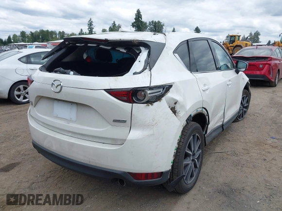 2018 Mazda CX-5 Grand Touring with VIN JM3KFBDM1J0382306, listed as a IAAI auction lot 42554947 with 121,303 mi miles and . Bid and sale history available at DreamBid. Image 4.