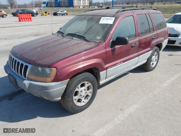 1999 Jeep Grand Cherokee Laredo with VIN 1J4GW58S6XC554582, listed as a IAAI auction lot 41780284 with 183,156 mi miles. Bid and sale history available at carsss.com. Image 2.
