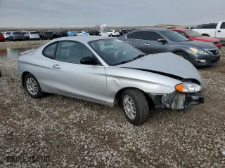 1999 Hyundai Tiburon with VIN KMHJG24F8XU126762, listed as a Copart auction lot 88747725 with 51,296 mi miles and Salvage Title. Bid and sale history available at carsss.com. Image 4.