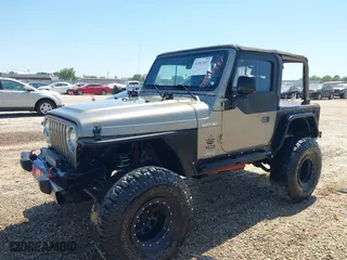 2004 Jeep Wrangler X with VIN 1J4FA39S04P717339, listed as a IAAI auction lot 41982497 with 168,629 mi miles. Bid and sale history available at carsss.com. Image 17.