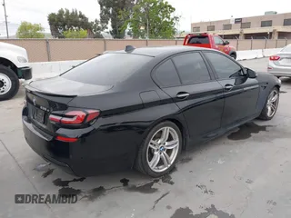 2014 BMW 5 Series 535d with VIN WBAXA5C59ED690375, listed as a IAAI auction lot 42030902 with 70,553 mi miles and . Bid and sale history available at carsss.com. Image 4.