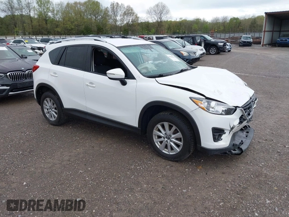 2016 Mazda CX-5 Touring with VIN JM3KE4CY0G0903723, listed as a IAAI auction lot 41966516 with 107,569 mi miles. Bid and sale history available at carsss.com. Image 1.