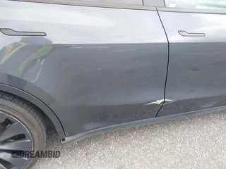 2022 Tesla Model Y Performance z VIN 7SAYGDEF5NF544542, wystawiony jako IAAI lot #42118855 z przebiegiem 27 256 mil mil oraz . Historia ofert i sprzedaży dostępna na DreamBid. Obrazek 21.