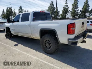 2015 GMC Sierra 2500HD available WiFi Denali with VIN 1GT120E80FF659215, listed as a Copart auction lot 48356455 with 134,796 mi miles and Salvage Title. Bid and sale history available at carsss.com. Image 2.