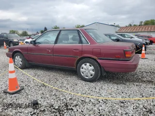 1991 Toyota Camry DLX z VIN 4T1SV21E0MU450578, wystawiony jako Copart lot #73990024 z przebiegiem 149 342 mil mil oraz Czysty tytuł • Clean title. Historia ofert i sprzedaży dostępna na DreamBid. Obrazek 2.