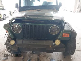 2000 Jeep Wrangler Sport with VIN 1J4FA49S8YP780104, listed as a IAAI auction lot 42095731 with Not provided miles and . Bid and sale history available at DreamBid. Image 13.