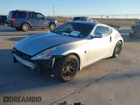 2014 Nissan 370Z Nismo with VIN JN1AZ4EH4EM634236, listed as a IAAI auction lot 41256664 with 80,294 mi miles and . Bid and sale history available at DreamBid. Image 16.