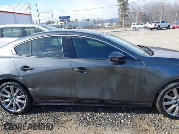 2023 Mazda 3 S Premium with VIN 3MZBPBDM8PM373434, listed as a IAAI auction lot 41234729 with 9,387 mi miles and . Bid and sale history available at DreamBid. Image 13.