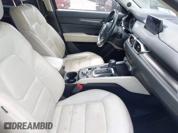 2018 Mazda CX-5 Grand Touring z VIN JM3KFADM8J1406007, wystawiony jako IAAI lot #42008567 z przebiegiem 110 661 mil mil oraz . Historia ofert i sprzedaży dostępna na DreamBid. Obrazek 5.