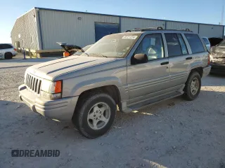 1998 Jeep Grand Cherokee with VIN 1J4FX48S4WC345469, listed as a Copart auction lot 80721224 with 201,543 mi miles and Salvage title. Bid and sale history available at DreamBid. Image 1.