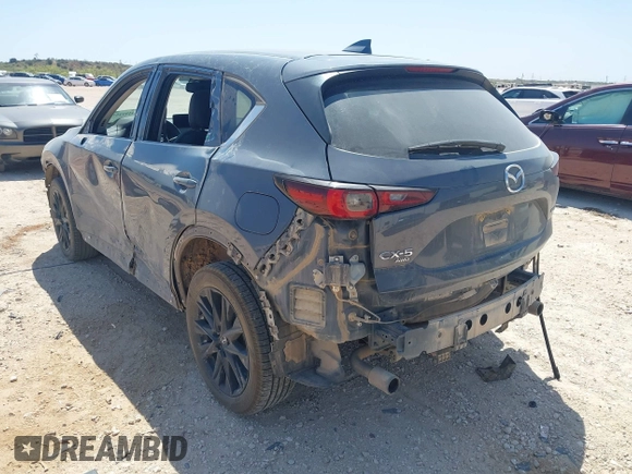 2023 Mazda CX-5 S Carbon Edition z VIN JM3KFBCM7P0164462, wystawiony jako IAAI lot #41919579 z przebiegiem 49 585 mil mil oraz . Historia ofert i sprzedaży dostępna na DreamBid. Obrazek 3.