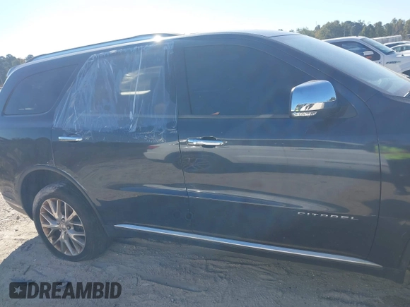 2014 Dodge Durango Citadel with VIN 1C4SDJETXEC390326, listed as a IAAI auction lot 40620779 with 119,537 mi miles and . Bid and sale history available at DreamBid. Image 13.