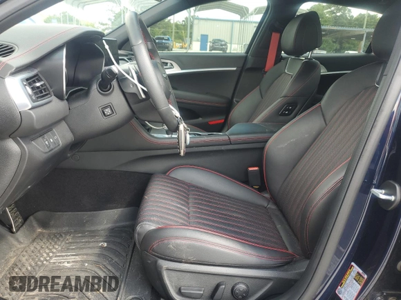 2023 Genesis G70 2.0T with VIN KMTG34TA8PU127827, listed as a Copart auction lot 59662305 with 6,310 mi miles and Salvage title. Bid and sale history available at DreamBid. Image 7.