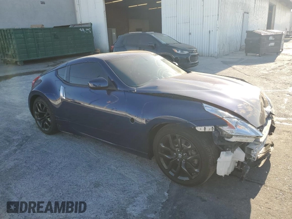2017 Nissan 370Z z VIN JN1AZ4EH6HM952086, wystawiony jako Copart lot #88158105 z przebiegiem Nie podano mil oraz Szkoda całkowita • Salvage title. Historia ofert i sprzedaży dostępna na DreamBid. Obrazek 4.