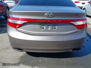 2013 Hyundai Azera with VIN KMHFH4JG2DA256481, listed as a IAAI auction lot 41673405 with 180,130 mi miles. Bid and sale history available at carsss.com. Image 6.