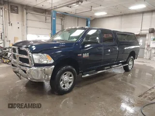 2015 Ram 2500 Tradesman z VIN 3C6TR5HTXFG605539, wystawiony jako IAAI lot #41833380 z przebiegiem 103 921 mil mil oraz . Historia ofert i sprzedaży dostępna na DreamBid. Obrazek 2.