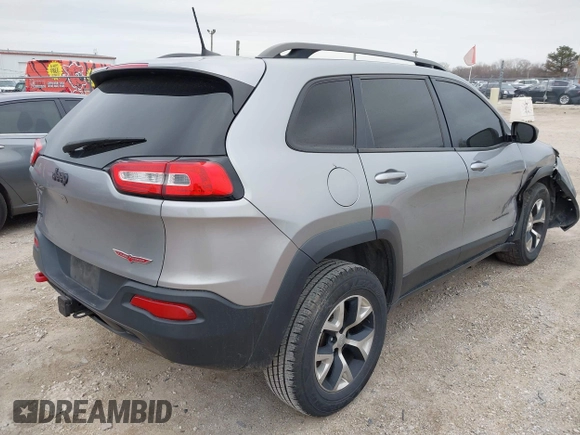 2016 Jeep Cherokee Trailhawk with VIN 1C4PJMBS7GW192574, listed as a IAAI auction lot 41986638 with 144,970 mi miles and . Bid and sale history available at DreamBid. Image 4.