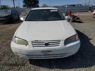 1997 Toyota Camry LE z VIN JT2BG22K4V0077954, wystawiony jako Copart lot #57682355 z przebiegiem 254 596 mil mil oraz Szkoda całkowita • Salvage title. Historia ofert i sprzedaży dostępna na DreamBid. Obrazek 5.