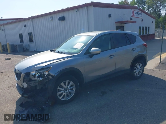 2014 Mazda CX-5 Touring with VIN JM3KE2CY9E0310315, listed as a IAAI auction lot 41943991 with 98,359 mi miles and . Bid and sale history available at carsss.com. Image 17.