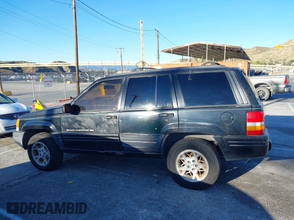1998 Jeep Grand Cherokee Limited with VIN 1J4GX78Y8WC110325, listed as a IAAI auction lot 41357373 with 165,106 mi miles. Bid and sale history available at carsss.com. Image 14.