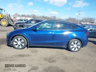 2021 Tesla Model Y Long Range with VIN 5YJYGDEE8MF293230, listed as a IAAI auction lot 41744033 with 56,797 mi miles and . Bid and sale history available at DreamBid. Image 14.