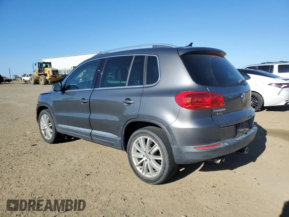 2014 Volkswagen Tiguan SEL with VIN WVGAV3AX0EW555873, listed as a Copart auction lot 55695955 with 69,984 mi miles and Salvage title. Bid and sale history available at DreamBid. Image 2.