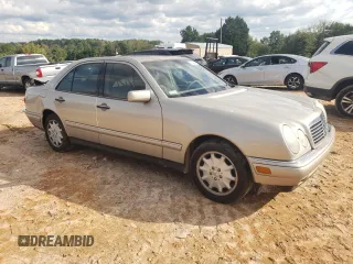 1999 Mercedes-Benz E-Class with VIN WDBJF65HXXA891437, listed as a Copart auction lot 73278334 with 197,159 mi miles and Salvage Title. Bid and sale history available at carsss.com. Image 4.