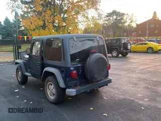 2003 Jeep Wrangler SE with VIN 1J4FA29143P371506, listed as a Copart auction lot 80153184 with 101,513 mi miles and Clean title. Bid and sale history available at DreamBid. Image 3.