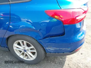 2018 Ford Focus SE z VIN 1FADP3FE1JL254632, wystawiony jako IAAI lot #42408683 z przebiegiem 74 696 mil mil oraz . Historia ofert i sprzedaży dostępna na DreamBid. Obrazek 6.