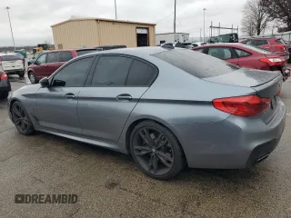 2018 BMW 5 Series M550i xDrive with VIN WBAJB9C54JB286707, listed as a Copart auction lot 49158435 with 74,307 mi miles and Salvage title. Bid and sale history available at DreamBid. Image 2.