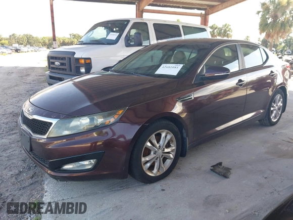 2013 Kia Optima EX z VIN 5XXGN4A71DG142137, wystawiony jako IAAI lot #42681081 z przebiegiem 115 892 mil mil oraz . Historia ofert i sprzedaży dostępna na DreamBid. Obrazek 2.