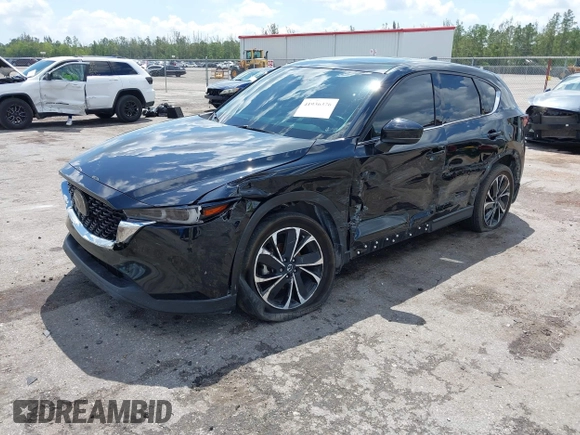 2023 Mazda CX-5 2.5 S Premium Plus Package with VIN JM3KFBEM5P0256652, listed as a IAAI auction lot 41936376 with 31,332 mi miles. Bid and sale history available at carsss.com. Image 2.