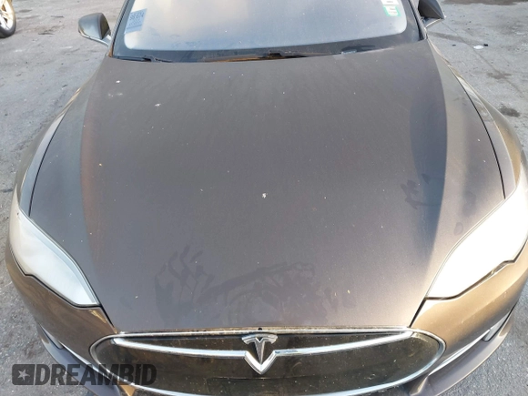 2014 Tesla Model S 60 z VIN 5YJSA1H19EFP51406, wystawiony jako IAAI lot #41561395 z przebiegiem Nie podano mil oraz . Historia ofert i sprzedaży dostępna na DreamBid. Obrazek 10.