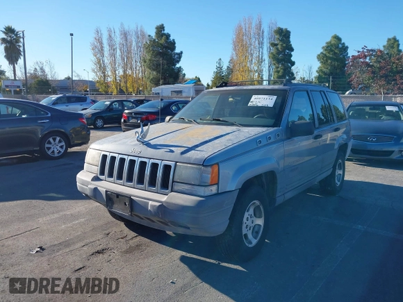 1996 Jeep Grand Cherokee Laredo with VIN 1J4FX58S8TC169575, listed as a IAAI auction lot 40971134 with 152,116 mi miles. Bid and sale history available at carsss.com. Image 6.