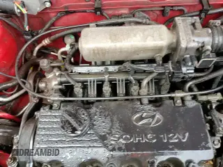 2000 Hyundai Accent z VIN KMHCF35G2YU013092, wystawiony jako Copart lot #86220124 z przebiegiem 153 844 mil mil oraz Szkoda całkowita • Salvage title. Historia ofert i sprzedaży dostępna na DreamBid. Obrazek 13.