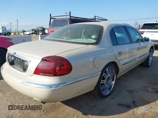 2002 Lincoln Continental with VIN 1LNHM97V22Y672557, listed as a IAAI auction lot 41442390 with 179,198 mi miles. Bid and sale history available at carsss.com. Image 4.