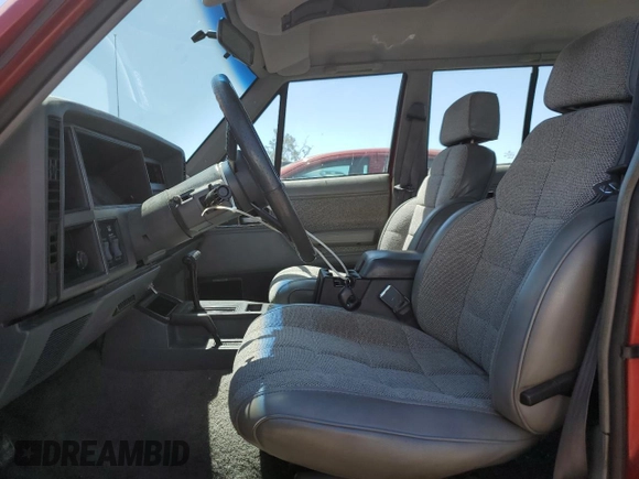 1992 Jeep Cherokee with VIN 1J4FJ58S0NL140995, listed as a Copart auction lot 56705875 with 253,657 mi miles and Salvage title. Bid and sale history available at DreamBid. Image 7.