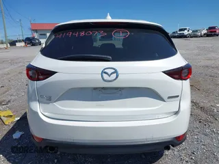 2021 Mazda CX-5 Touring z VIN JM3KFBCM2M1395663, wystawiony jako IAAI lot #41948073 z przebiegiem 47 029 mil mil oraz . Historia ofert i sprzedaży dostępna na DreamBid. Obrazek 16.