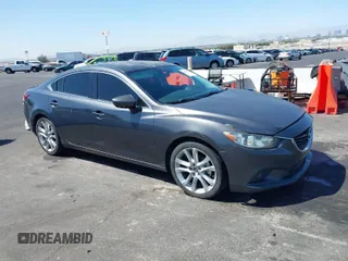 2014 Mazda Mazda6 i Touring with VIN JM1GJ1V52E1104111, listed as a IAAI auction lot 42008695 with 241,149 mi miles. Bid and sale history available at carsss.com. Image 1.