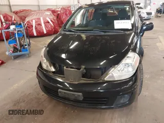 2009 Nissan Versa 1.8 S with VIN 3N1BC13E39L415491, listed as a IAAI auction lot 41614914 with 104,795 mi miles. Bid and sale history available at carsss.com. Image 12.
