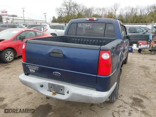 2005 Ford Explorer Sport Trac XLS with VIN 1FMZU77K35UA59213, listed as a IAAI auction lot 41690884 with 219,652 mi miles. Bid and sale history available at carsss.com. Image 4.