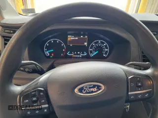 2020 Ford Transit Cargo z VIN 1FTBR2YG3LKA51867, wystawiony jako IAAI lot #42787593 z przebiegiem 89 403 mil mil oraz . Historia ofert i sprzedaży dostępna na DreamBid. Obrazek 1.