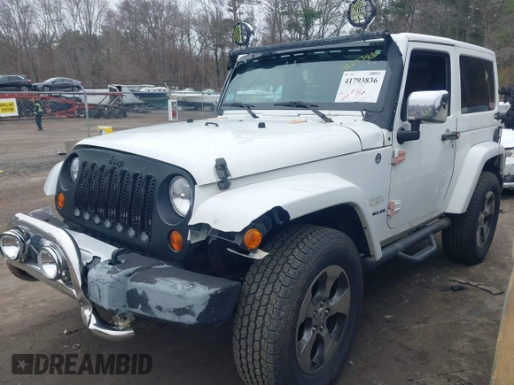 2011 Jeep Wrangler Sahara with VIN 1J4AA5D15BL538240, listed as a IAAI auction lot 41793836 with 172,528 mi miles and . Bid and sale history available at carsss.com. Image 2.