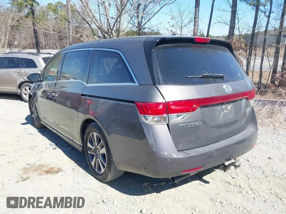 2014 Honda Odyssey Touring with VIN 5FNRL5H92EB016546, listed as a IAAI auction lot 41689148 with 143,601 mi miles and . Bid and sale history available at DreamBid. Image 3.