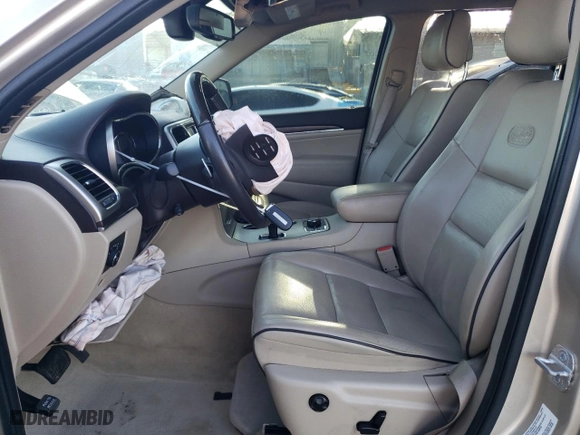2014 Jeep Grand Cherokee Overland with VIN 1C4RJFCM2EC556953, listed as a Copart auction lot 73046974 with 106,889 mi miles and Salvage Title. Bid and sale history available at carsss.com. Image 7.