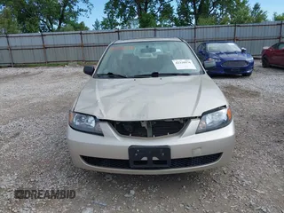 2001 Mazda Protege LX z VIN JM1BJ226210439446, wystawiony jako IAAI lot #42336976 z przebiegiem 155 990 mil mil oraz . Historia ofert i sprzedaży dostępna na DreamBid. Obrazek 13.