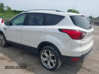2019 Ford Escape Titanium with VIN 1FMCU9J90KUA86338, listed as a IAAI auction lot 42690159 with 115,891 mi miles and . Bid and sale history available at DreamBid. Image 3.