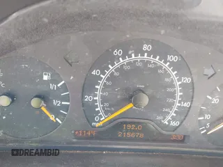 1999 Mercedes-Benz E-Class with VIN WDBJH65F3XA845635, listed as a IAAI auction lot 42102122 with 215,678 mi miles. Bid and sale history available at carsss.com. Image 7.