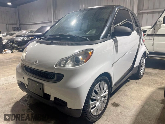 2012 Smart fortwo Pure z VIN WMEEJ3BA5CK540092, wystawiony jako Copart lot #57123825 z przebiegiem 59 356 mil mil oraz Szkody całkowita. Historia ofert i sprzedaży dostępna na DreamBid. Obrazek 2.